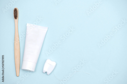 Oral hygien products on a light blue background with a place to insert text. photo