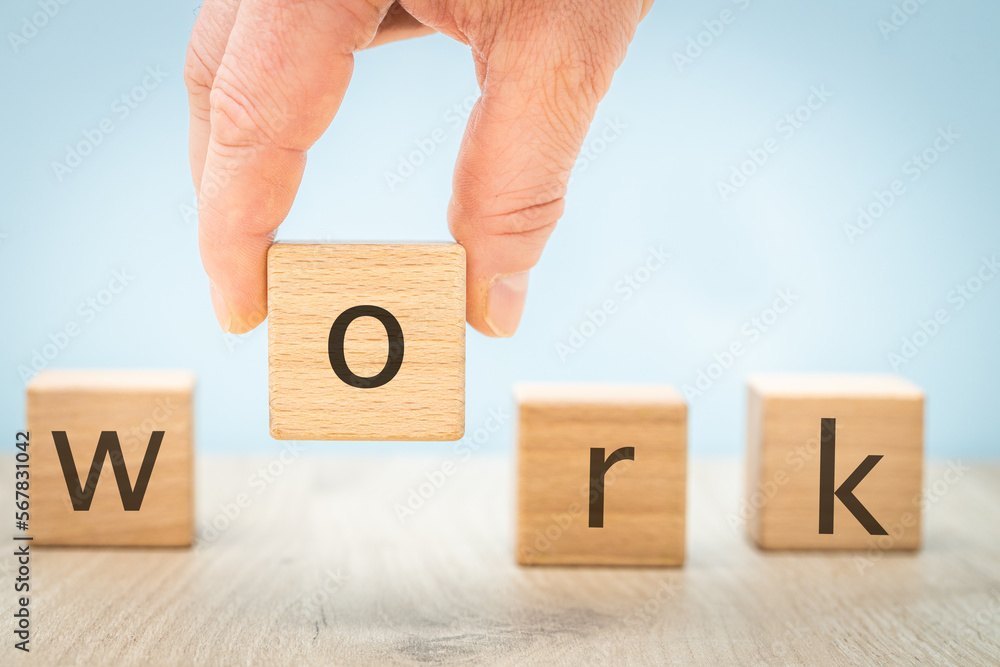 Work, Written on wooden blocks, One cube held in hand, Business concept, Attractive job offer, Working in a creative team, Looking for ambitious challenges Work, Written on wooden blocks, One cube held in hand, Business concept, Attractive job offer, Working in a creative team, Looking for ambitious challenges