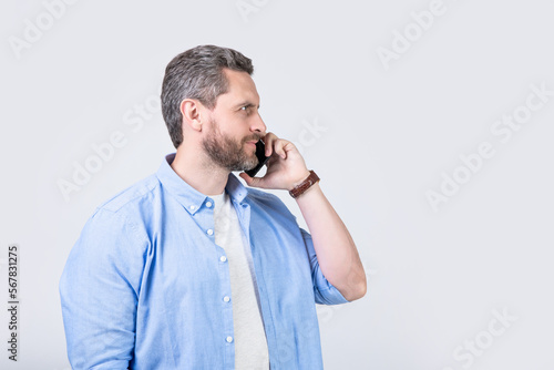 photo of man smile having communication call. man has communication call on phone
