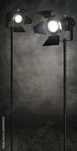 A vertical grunge background banner, with studio spotlights and copy space. A film, photoshoot or movie on set concept template, ideal for festivals, shows, courses or events