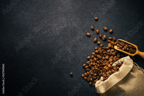 Roasted coffee beans in burlap bag.