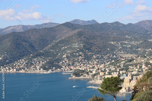Camogli, Italy - January 28, 2023: An aerial view to the city of Camogli. Beautiful landscape from the ligurian sea with blue sky and mountains in the background. 