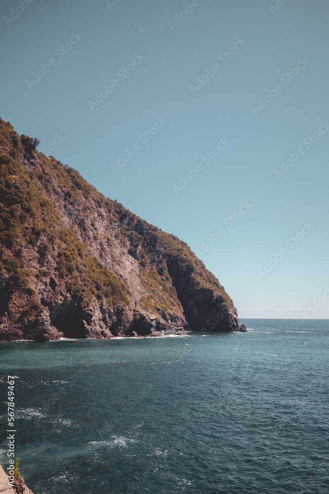 View on the colorful houses and the sea along the coastline of Cinque Terre area in Riomaggiore View on the colorful houses and the sea along the coastline of Cinque Terre area in Riomaggiore