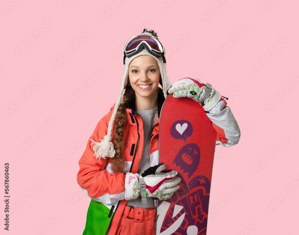 Snowboarder young woman posing on background Winter sport concept. Snowboarder young woman posing on background Winter sport concept.