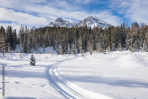 winter mountain landscape with scooter track