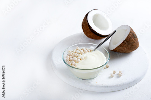 Coconut yogurt on white background