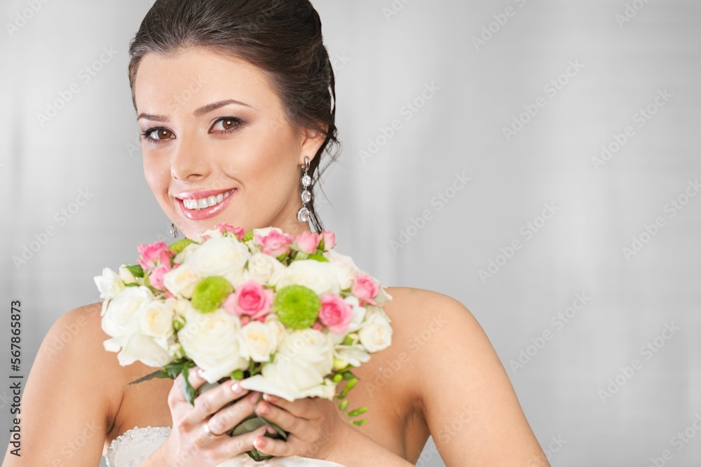Happy young smart woman posing with flowers Happy young smart woman posing with flowers