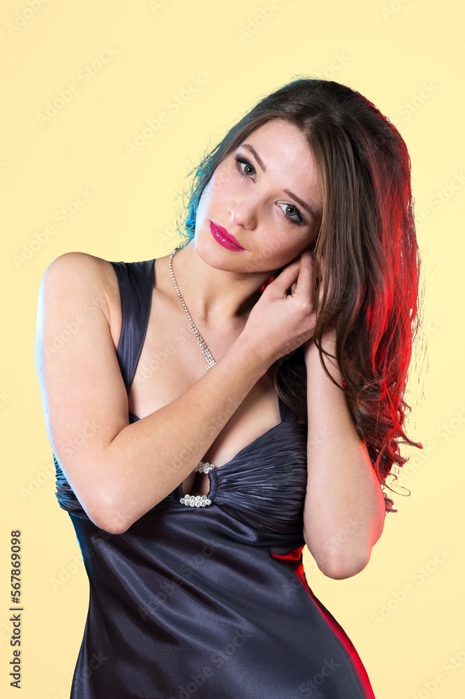 Smiling young woman posing in dress Smiling young woman posing in dress