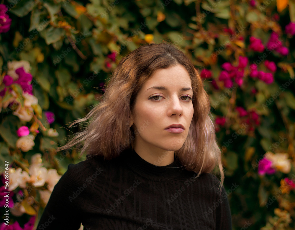 beautiful woman on a background of flowers beautiful woman on a background of flowers