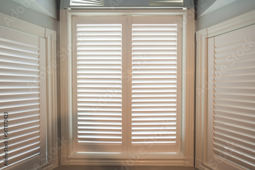 close up of an open window with shutters
