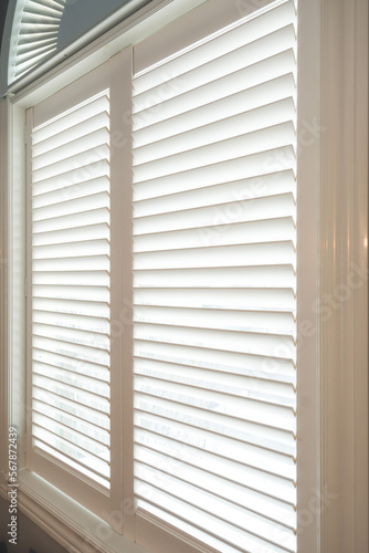close up of an open window with shutters
