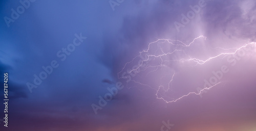 panoramic photograph of lightning crossing the sky from the right