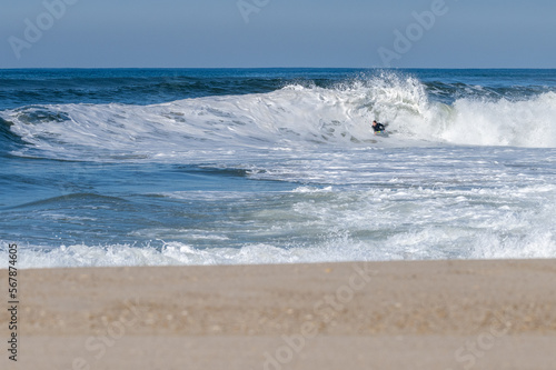 Bodyboarder surfing ocean wave