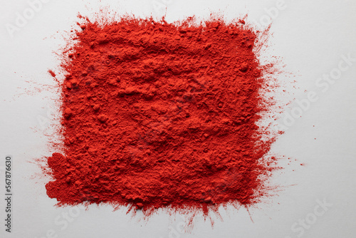 Close up of red powder with copy space on white background