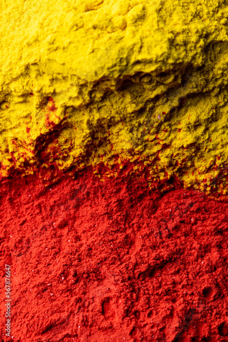 Close up of red and yellow powder with copy space