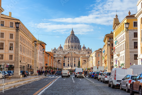 Fototapeta Naklejka Na Ścianę i Meble -  St. Peter's Basilica in urban streets of Downtown Rome, Italy. Cloudy Sky.