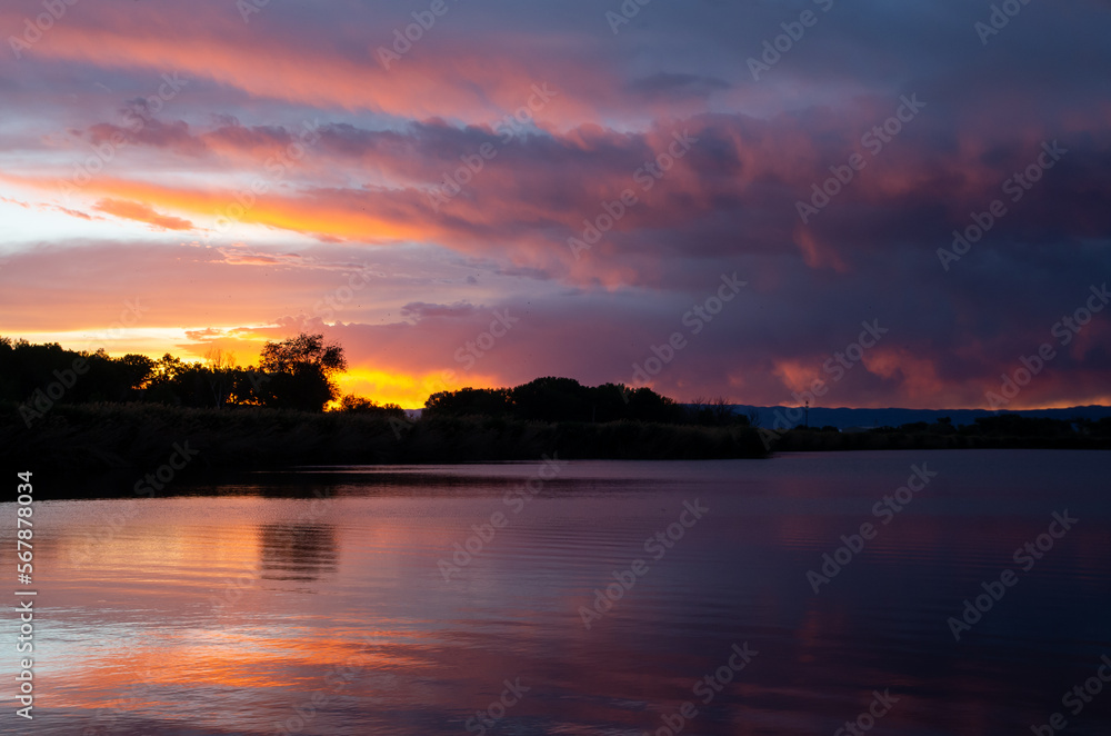 Western sunset reflected in calm water