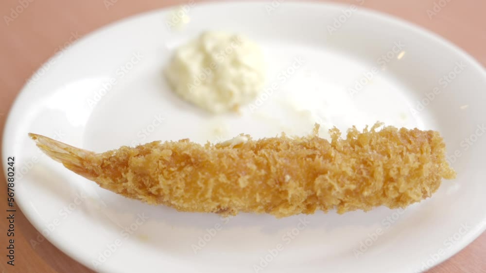 This panning video shows a gourmet panko shrimp plated with a dipping sauce. This panning video shows a gourmet panko shrimp plated with a dipping sauce.