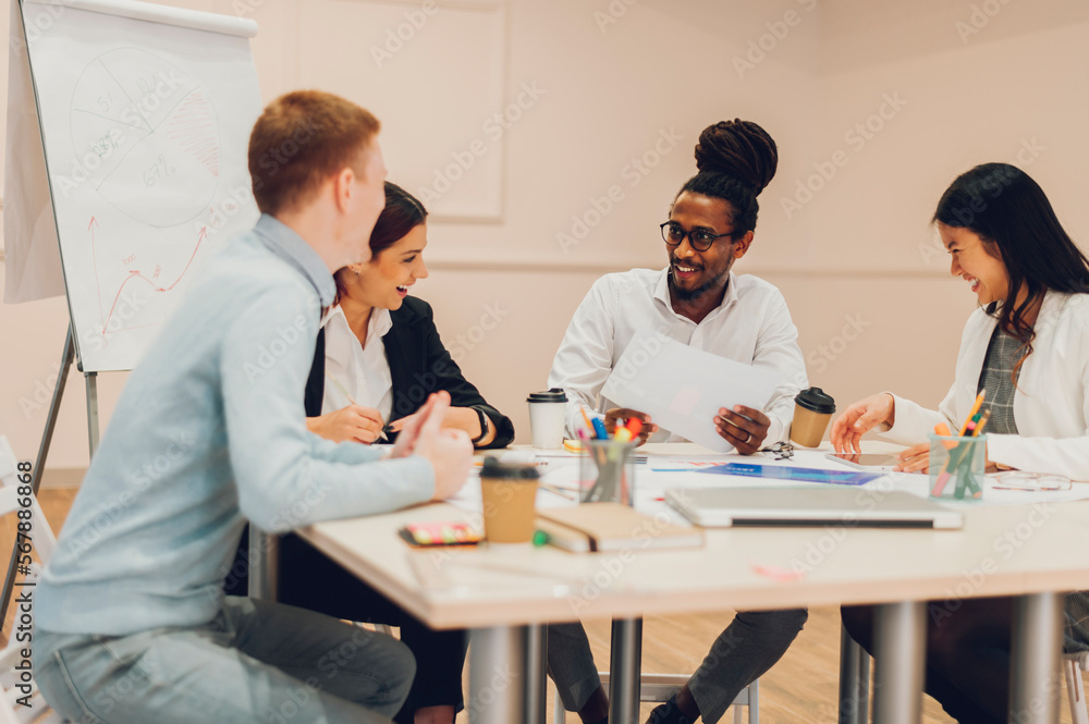 Multiracial business team having a meeting in office Multiracial business team having a meeting in office