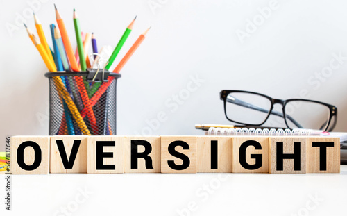 Tapeta word Oversight on wooden block, concept business