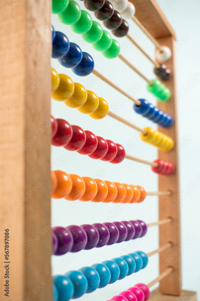 Colorful wooden abacus on green background Colorful wooden abacus on green background