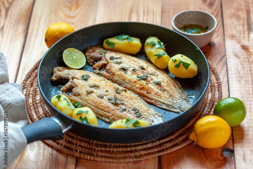 Sole flatfish cooked on a pan, portion for two photo
