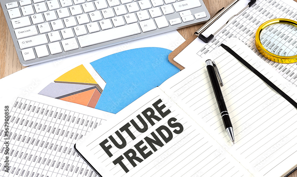 FUTURE TRENDS text on a paper on chart background FUTURE TRENDS text on a paper on chart background