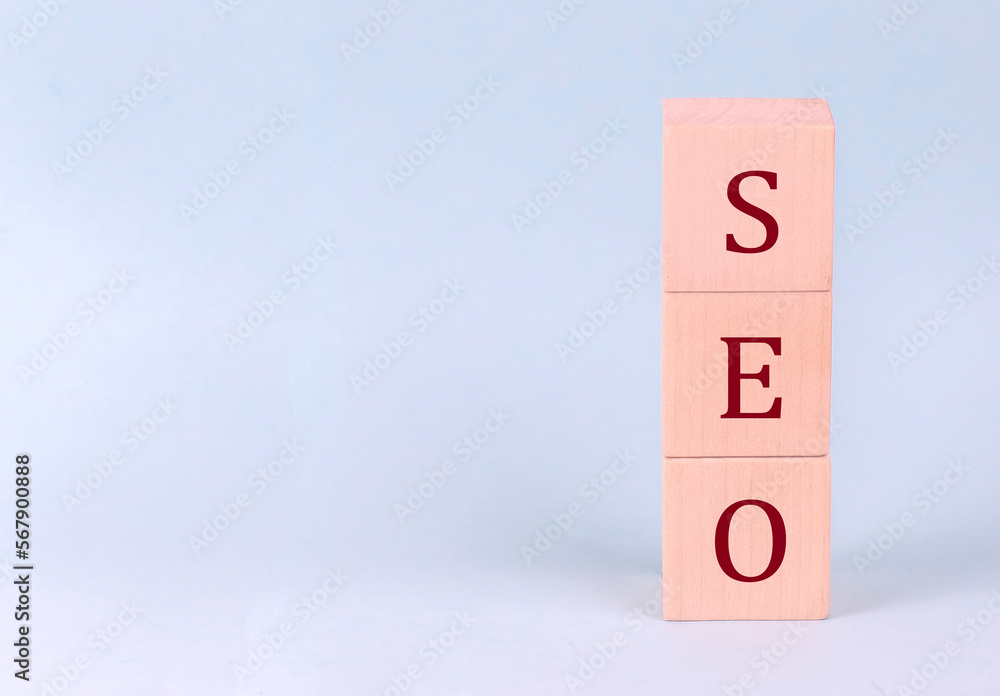 SEO on wooden cubes on a blue background SEO on wooden cubes on a blue background