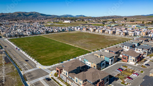 Photography Aerial photos over apartments and houses in Dublin, California with a green fiel