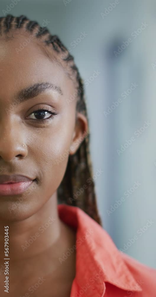 Vertical video of happy african american woman looking at camera Vertical video of happy african american woman looking at camera