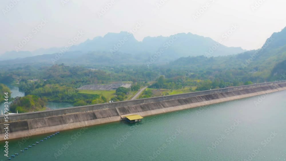 Aerial view of dam tower crane. Reservoir and sea water in recycle energy industry concept for electricity in Natural landscape background. Environment. Aerial view of dam tower crane. Reservoir and sea water in recycle energy industry concept for electricity in Natural landscape background. Environment.