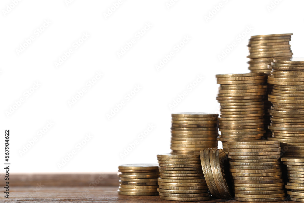 Stack of coins on wooden table, closeup. Space for text Stack of coins on wooden table, closeup. Space for text