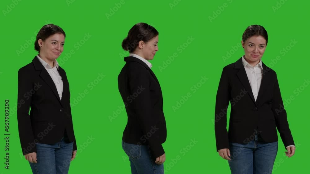 Close up of female manager wearing office suit in studio, acting stylish and confident on camera. Businesswoman with corporate job standing over isolated greenscreen background. Close up of female manager wearing office suit in studio, acting stylish and confident on camera. Businesswoman with corporate job standing over isolated greenscreen background.