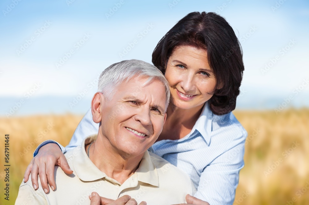 Fototapeta premium Mature old couple looking happy outdoors at farm,
