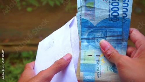 Stock Footage indonesian rupiah the official currency of Indonesia. Bank Indonesia notes background photo