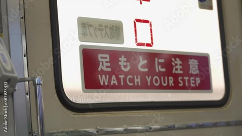 Watch Your Step Sign In Japanese Train photo