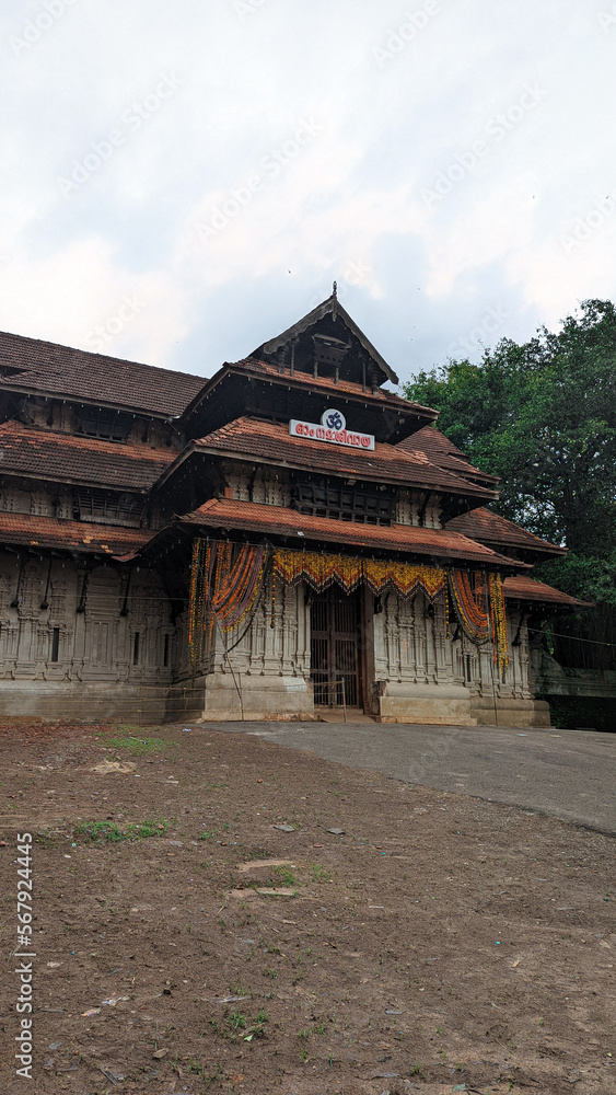 entrance of a historical temple of worship for hindus in kerala in the daytime entrance of a historical temple of worship for hindus in kerala in the daytime