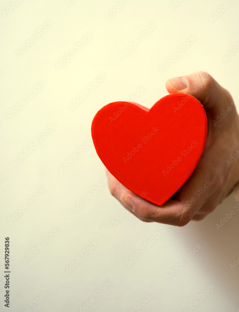 red heart in hand. Valentine day. Sensual. Gift. Heart.