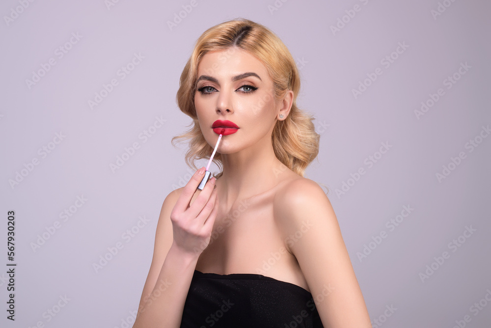 Sexy woman with lipstick. Photo of sensual girl with perfect makeup and plump lips on studio background. Beauty concept. Colored lipstick. Beauty and cosmetics concept. Lips correction. Sexy woman with lipstick. Photo of sensual girl with perfect makeup and plump lips on studio background. Beauty concept. Colored lipstick. Beauty and cosmetics concept. Lips correction.