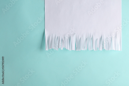 Slika na platnu White cut shredded paper on blue background