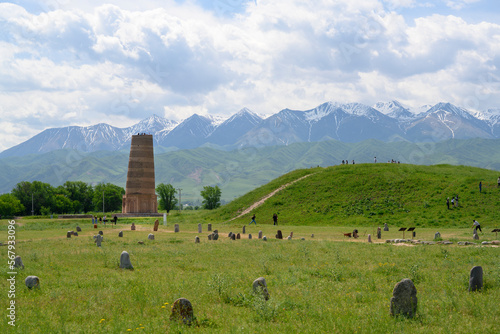 Ancient Burana settlement with stone sculptures of 6-10 centuries of nomadic Turks and Burana Tower - a minaret of the 9—11 centuries at the foot of the mountains in Kyrgyzstan