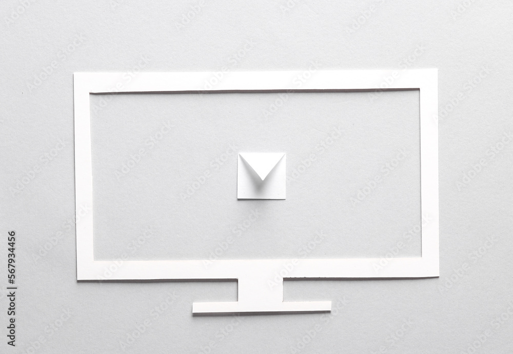 Paper cut tv with envelope on gray background Paper cut tv with envelope on gray background