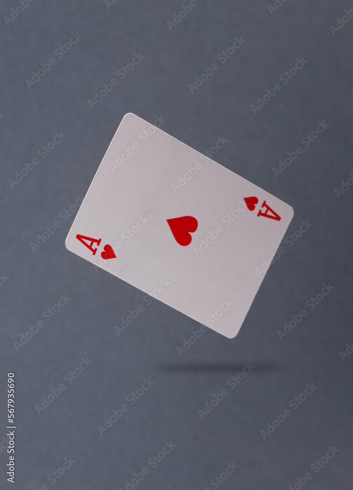 Obraz premium Ace of hearts levitating on a gray background