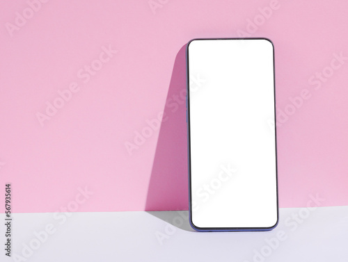 Smartphone mockup with white blank screen on gray pink background