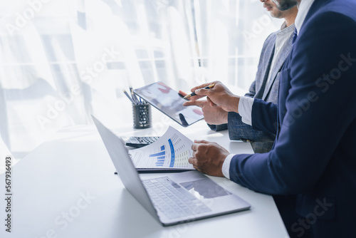 Using tablet pc, Consultant between bookkeepers and accounting lawyer consultation about asset, balance sheet, stock market statistics and yearly tax law, protect business from bribery.