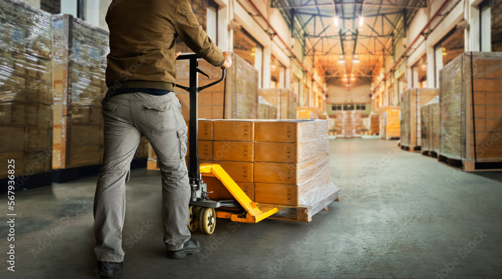 Workers Unloading Packaging Boxes on Pallets in Warehouse. Cartons, Package Boxes. Pallet Jack Loader. Shipping Supplies Warehouse. Supply Chain Shipment Goods. Distribution Warehouse Logistics	 - obrazy, fototapety, plakaty 