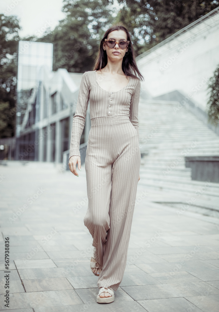 Fototapeta premium Stylish fashionable young woman in sunglasses outdoors. Street fashion