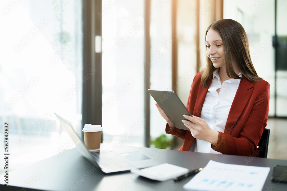 business owner or Asian female marketers are using tablet computer in office work business owner or Asian female marketers are using tablet computer in office work