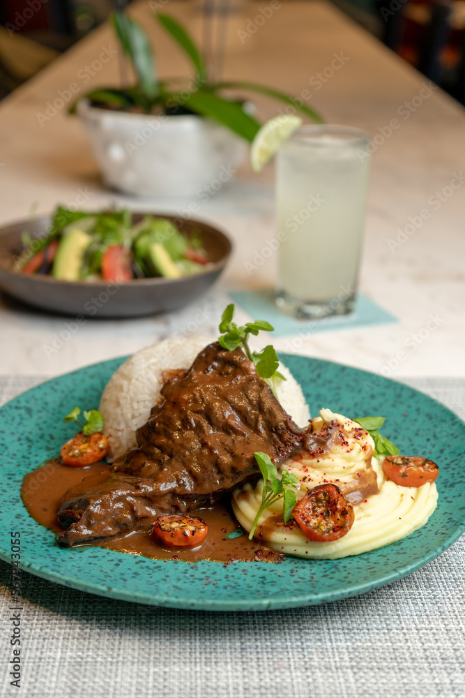 Steak in the pot with mashed potatoes, typical food from Peru. Steak in the pot with mashed potatoes, typical food from Peru.