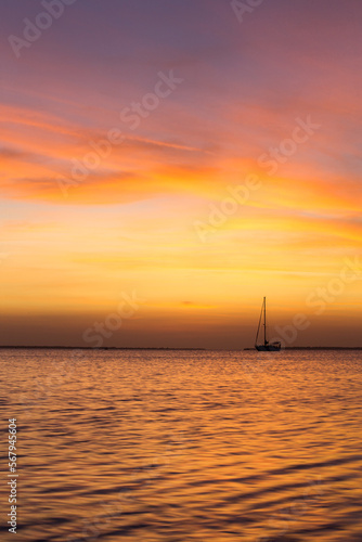 Colorful sunset over ocean on tropical island © Pakhnyushchyy